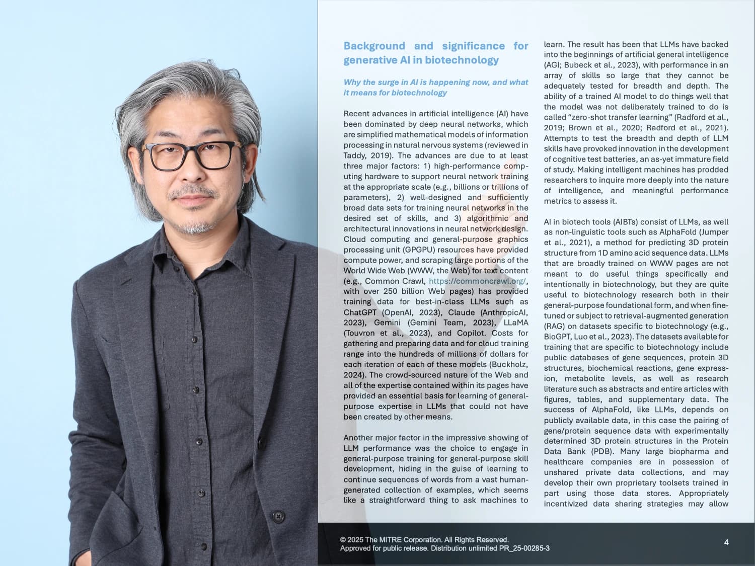 A presenter standing at the left of the frame while the two full pages of his own document fill the rest of it, text legible.